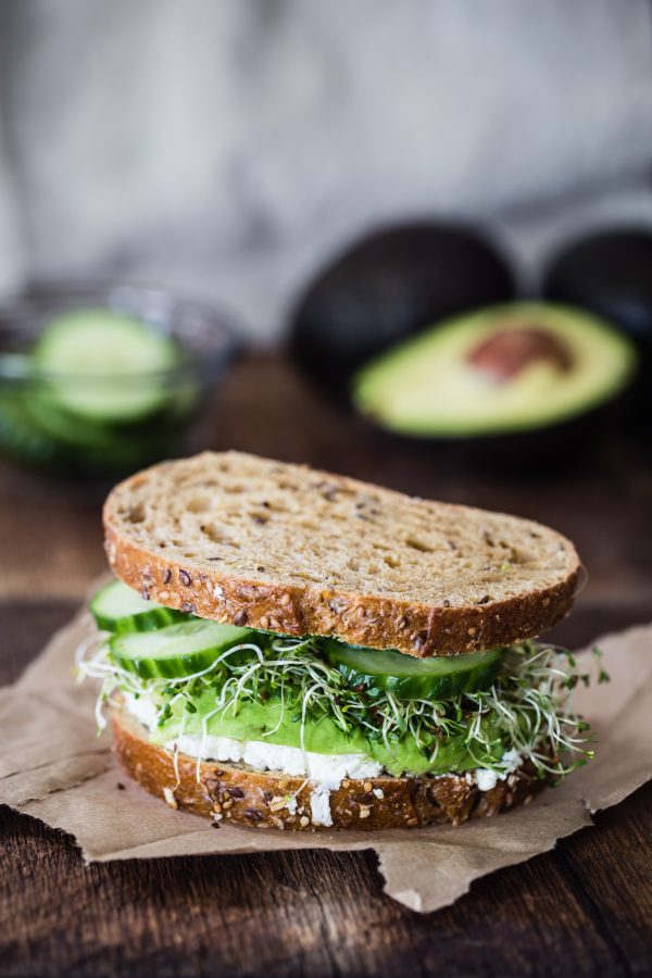 Avocado, cucumber, goat cheese sandwich